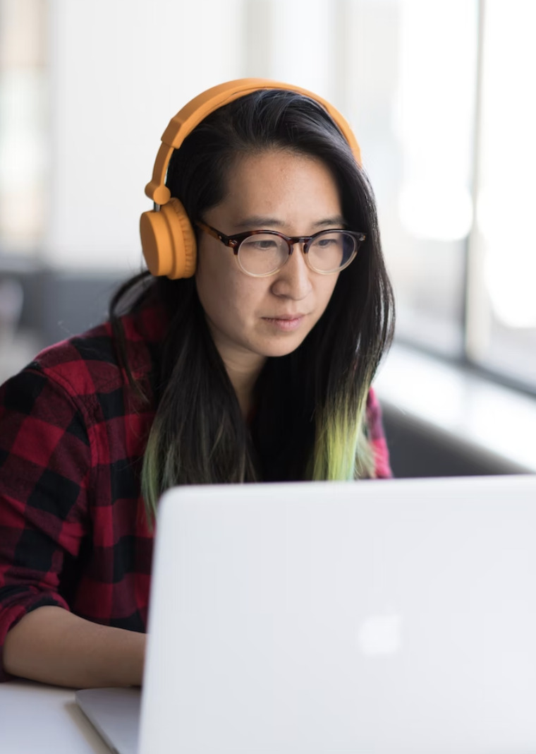 Girl focusing on laptop